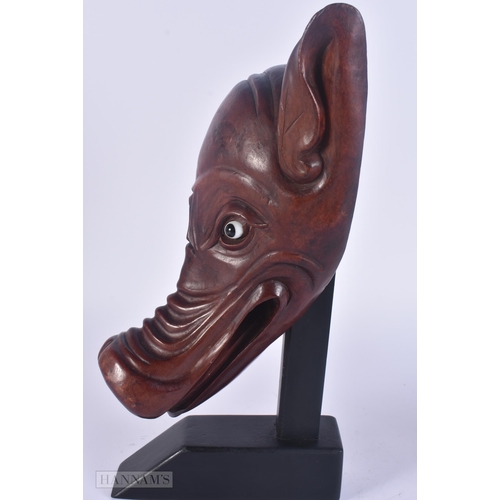428 - AN UNUSUAL 19TH CENTURY CHINESE CARVED HARDWOOD WILD BOAR HEAD Qing. 32 cm x 10 cm.