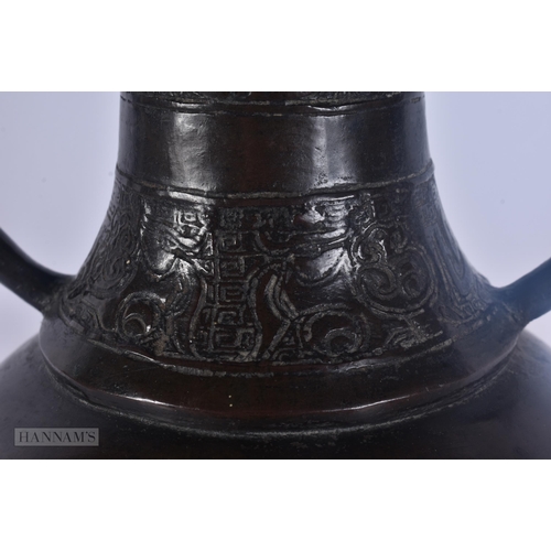 429 - A 17TH/18TH CENTURY CHINESE TWIN HANDLED BRONZE PRESENTATION VASE Ming/Qing. 30 cm x 12 cm.