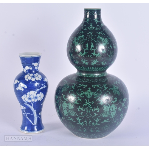 430 - A 19TH CENTURY CHINESE BLUE AND WHITE PORCELAIN PRUNUS VASE Kangxi style, together with a famille no... 