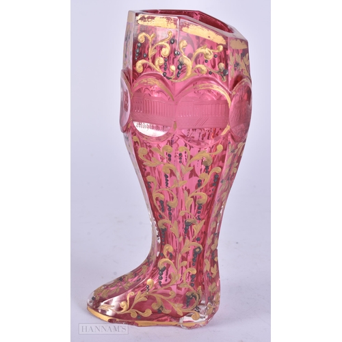 436 - A RARE 19TH BOHEMIAN RUBY AND GILDED GLASS BOOT engraved with monuments. 17.5 cm high.