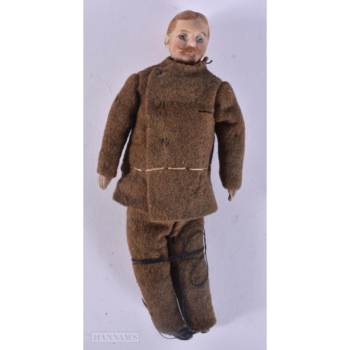 439 - AN UNUSUAL WWII MILITARY PORCELAIN HEADED DOLL. 13 cm long.