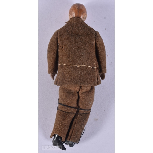 439 - AN UNUSUAL WWII MILITARY PORCELAIN HEADED DOLL. 13 cm long.