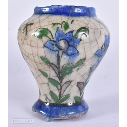 444 - AN EARLY ISLAMIC PERSIAN QAJAR POTTERY VASE. 11 cm high.