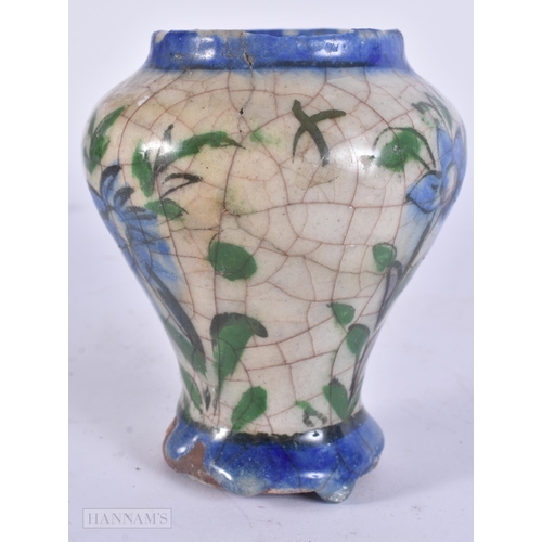 444 - AN EARLY ISLAMIC PERSIAN QAJAR POTTERY VASE. 11 cm high.