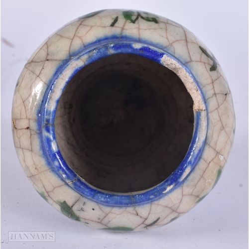 444 - AN EARLY ISLAMIC PERSIAN QAJAR POTTERY VASE. 11 cm high.