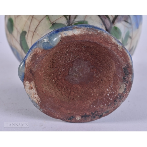 444 - AN EARLY ISLAMIC PERSIAN QAJAR POTTERY VASE. 11 cm high.