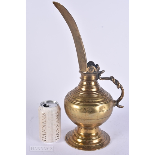 448 - AN UNUSUAL ANTIQUE MIDDLE EASTERN HIGH SPOUTED EWER. 38 cm high.