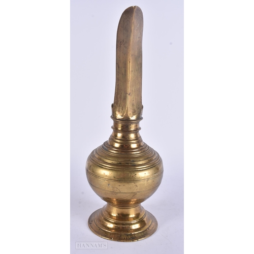 448 - AN UNUSUAL ANTIQUE MIDDLE EASTERN HIGH SPOUTED EWER. 38 cm high.
