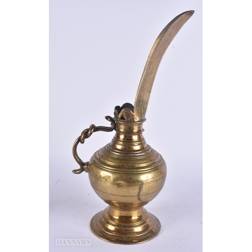 448 - AN UNUSUAL ANTIQUE MIDDLE EASTERN HIGH SPOUTED EWER. 38 cm high.