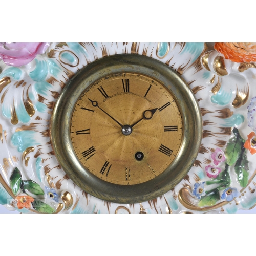 449 - A 19TH CENTURY FRENCH PORCELAIN ROCOCO MANTEL CLOCK encrusted with flowers. 30 cm x 17 cm.