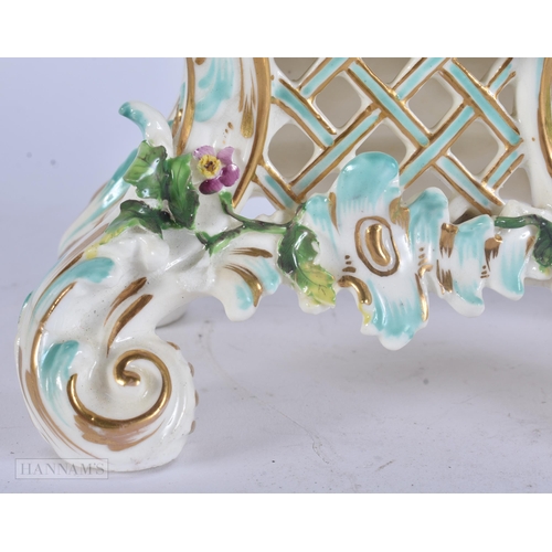 449 - A 19TH CENTURY FRENCH PORCELAIN ROCOCO MANTEL CLOCK encrusted with flowers. 30 cm x 17 cm.