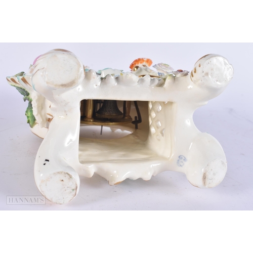 449 - A 19TH CENTURY FRENCH PORCELAIN ROCOCO MANTEL CLOCK encrusted with flowers. 30 cm x 17 cm.