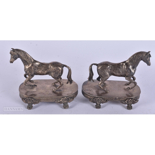 451 - A PAIR OF ANTIQUE CONTINENTAL SILVER HORSES. 294 grams. 11 cm x 9 cm.