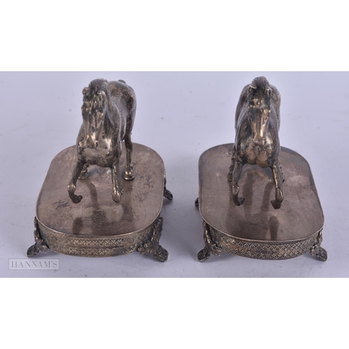 451 - A PAIR OF ANTIQUE CONTINENTAL SILVER HORSES. 294 grams. 11 cm x 9 cm.