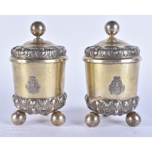 453 - A PAIR OF ANTIQUE CONTINENTAL SILVER GILT CUPS AND COVERS. 14 cm high.