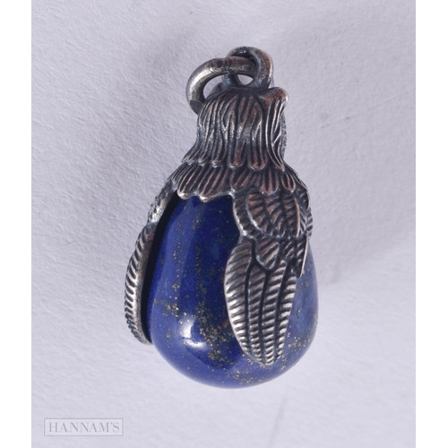 461 - A CONTINENTAL SILVER AND LAPIS PENDANT. 6.3 grams. 2.75 cm x 1.5 cm.