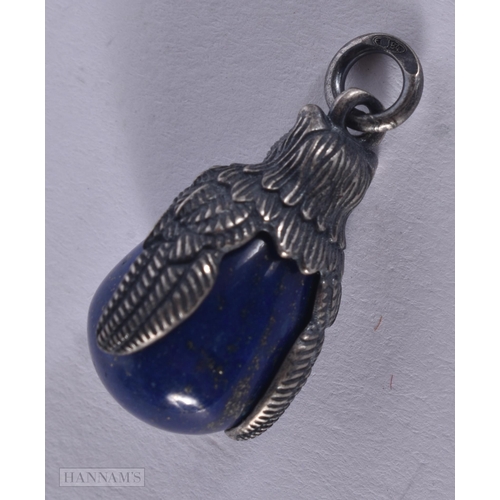 461 - A CONTINENTAL SILVER AND LAPIS PENDANT. 6.3 grams. 2.75 cm x 1.5 cm.
