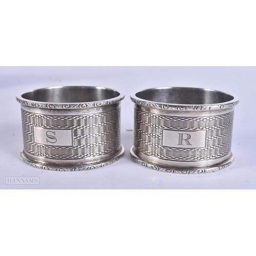 465 - A PAIR OF CASED ANTIQUE SILVER NAPKIN RINGS. 70 grams. 5 cm wide.