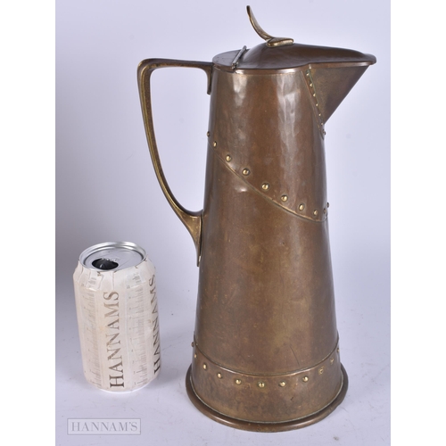 467 - A LARGE WMF BRASS JUG. 32 cm high.