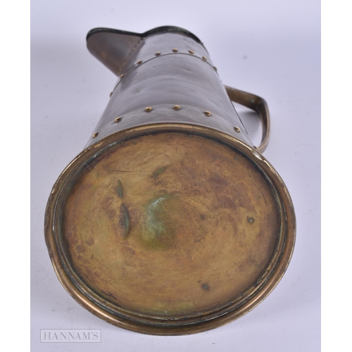 467 - A LARGE WMF BRASS JUG. 32 cm high.