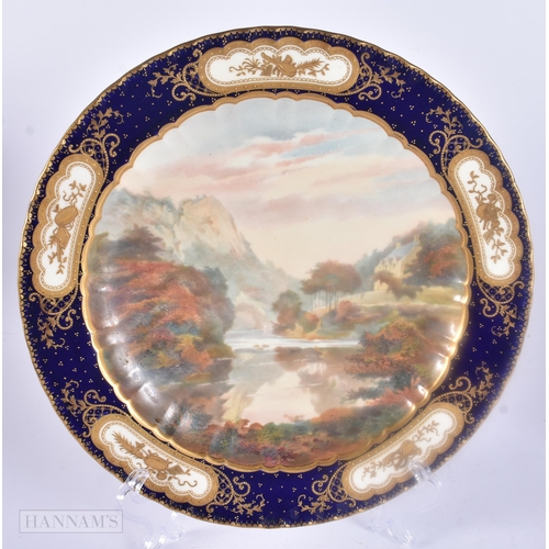 487 - A PAIR OF ROYAL CROWN DERBY PORCELAIN LANDSCAPE PLATES. 23 cm wide.