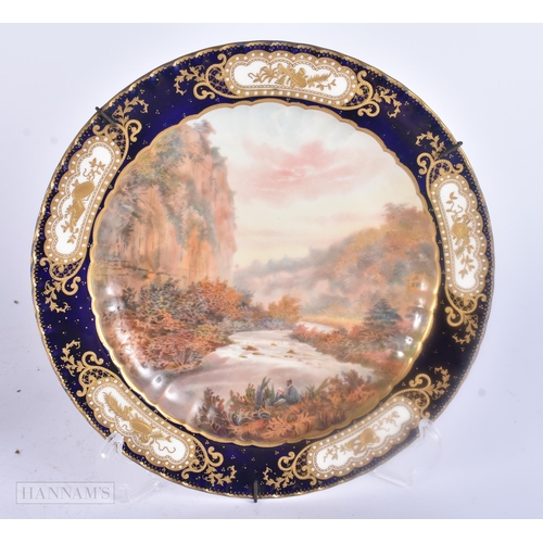 487 - A PAIR OF ROYAL CROWN DERBY PORCELAIN LANDSCAPE PLATES. 23 cm wide.
