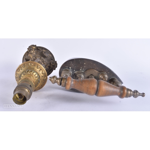 488 - AN ANTIQUE IRON together with a French bronze candlestick lamp. Largest 26.5 cm high. (2)