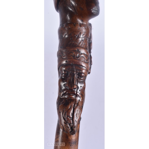 490 - AN 18TH/19TH CENTURY CONTINENTAL FOLK ART CARVED WOOD WALKING CANE. 100 cm long.