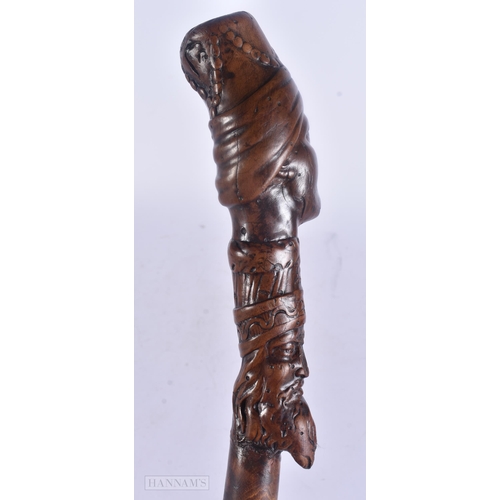 490 - AN 18TH/19TH CENTURY CONTINENTAL FOLK ART CARVED WOOD WALKING CANE. 100 cm long.