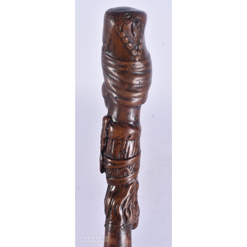 490 - AN 18TH/19TH CENTURY CONTINENTAL FOLK ART CARVED WOOD WALKING CANE. 100 cm long.