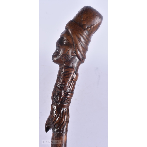 490 - AN 18TH/19TH CENTURY CONTINENTAL FOLK ART CARVED WOOD WALKING CANE. 100 cm long.