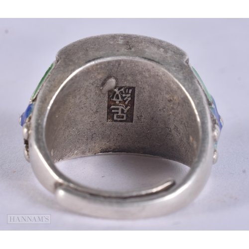 497 - A CHINESE WHITE METAL AND ENAMEL RING. 21 grams. Q.