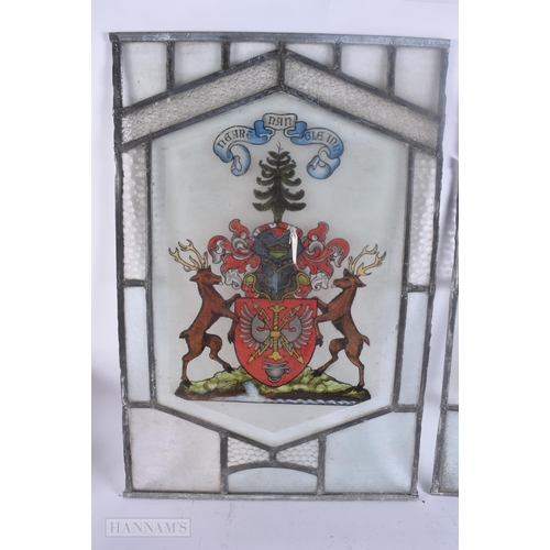 502 - A PAIR OF STAINED GLASS WINDOWS. 60 cm x 42 cm.