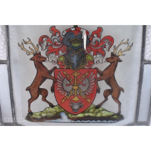 502 - A PAIR OF STAINED GLASS WINDOWS. 60 cm x 42 cm.