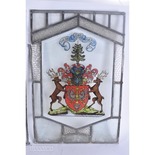 502 - A PAIR OF STAINED GLASS WINDOWS. 60 cm x 42 cm.