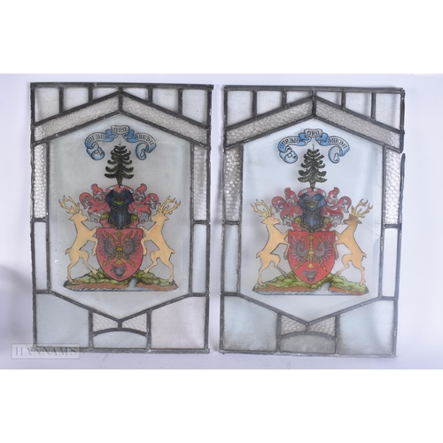 502 - A PAIR OF STAINED GLASS WINDOWS. 60 cm x 42 cm.