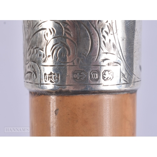 507 - A VICTORIAN SILVER MOUNTED RHINOCEROS HORN WALKING CANE. 88 cm long.