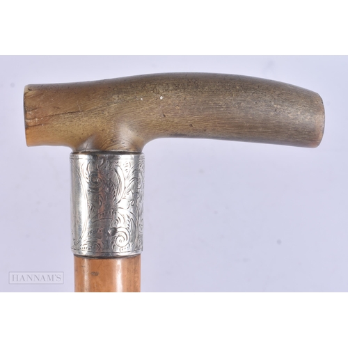 507 - A VICTORIAN SILVER MOUNTED RHINOCEROS HORN WALKING CANE. 88 cm long.