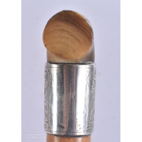 507 - A VICTORIAN SILVER MOUNTED RHINOCEROS HORN WALKING CANE. 88 cm long.