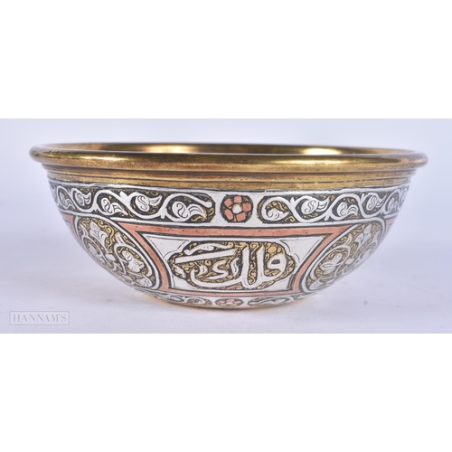 510 - A 19TH CENTURY ISLAMIC SILVER INLAID MIXED METAL BOWL decorated with scripture. 12 cm diameter.