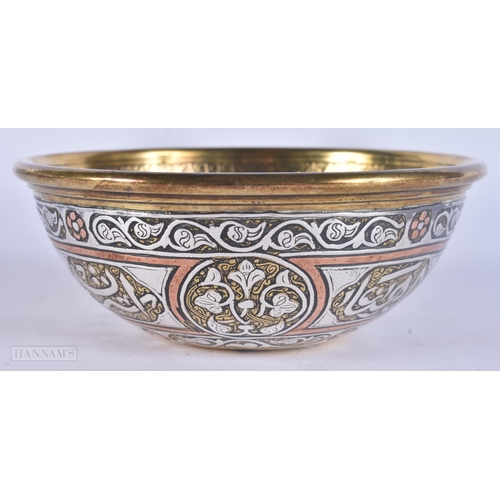 510 - A 19TH CENTURY ISLAMIC SILVER INLAID MIXED METAL BOWL decorated with scripture. 12 cm diameter.