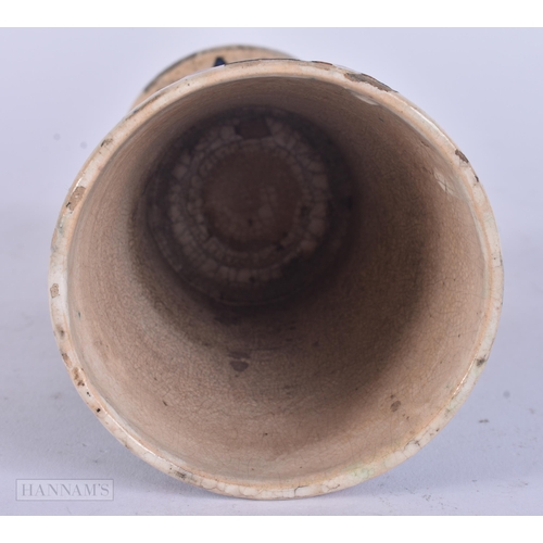 511 - A PERSIAN ISLAMIC FAIENCE POTTERY BEAKER. 13 cm high.