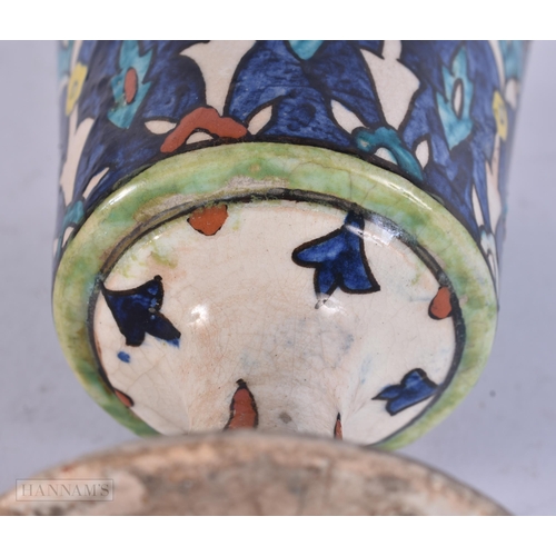 511 - A PERSIAN ISLAMIC FAIENCE POTTERY BEAKER. 13 cm high.