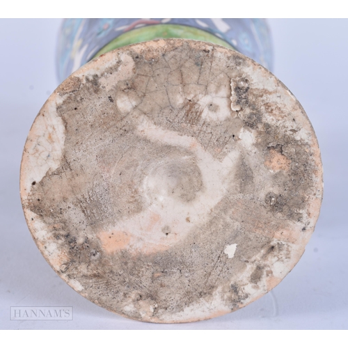 511 - A PERSIAN ISLAMIC FAIENCE POTTERY BEAKER. 13 cm high.