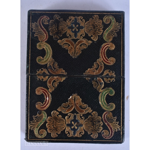 522 - A VICTORIAN TOOLED LEATHER CARD CASE together with a papier mache leather aide memoire. 10 cm x 8 cm... 