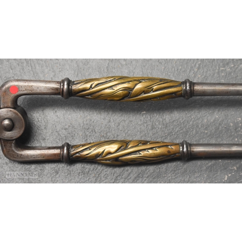 525 - A FINE AND LARGE PAIR OF 18TH CENTURY BRONZE AND STEEL FIRESIDE TOOLS. 90 cm long.
