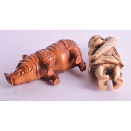 530 - A 19TH CENTURY JAPANESE MEIJI PERIOD CARVED STAG ANTLER NETSUKE together with another. Largest 7.25 ... 