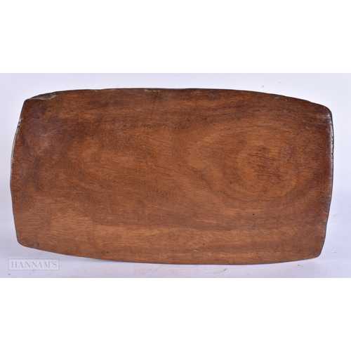 661 - A 19TH CENTURY AFRICAN TRIBAL CARVED WOOD STOOL HEADREST. 28 cm wide.