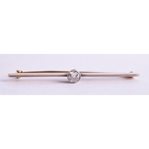 767 - A GOLD AND DIAMOND BAR BROOCH. 4 grams. 5.25 cm x 0.5 cm.