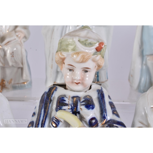 887 - TEN ASSORTED CONTINENTAL PORCELAIN NODDING FIGURES. 17 cm high. (10)